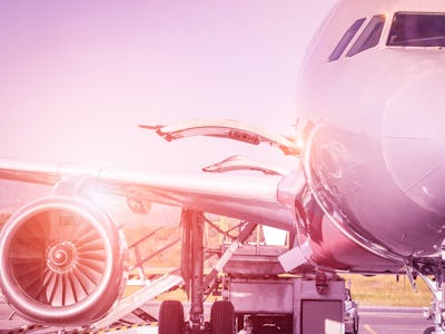 Detail of airplane at terminal gate before takeoff - Travel concept and wander around the world in i...