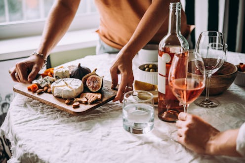 Offering appetizers at a friendly party. Dinner or aperitivo party concept.