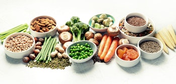 Food sources of plant based protein. Healthy diet with  legumes, dried fruit, seeds, nuts and vegeta...
