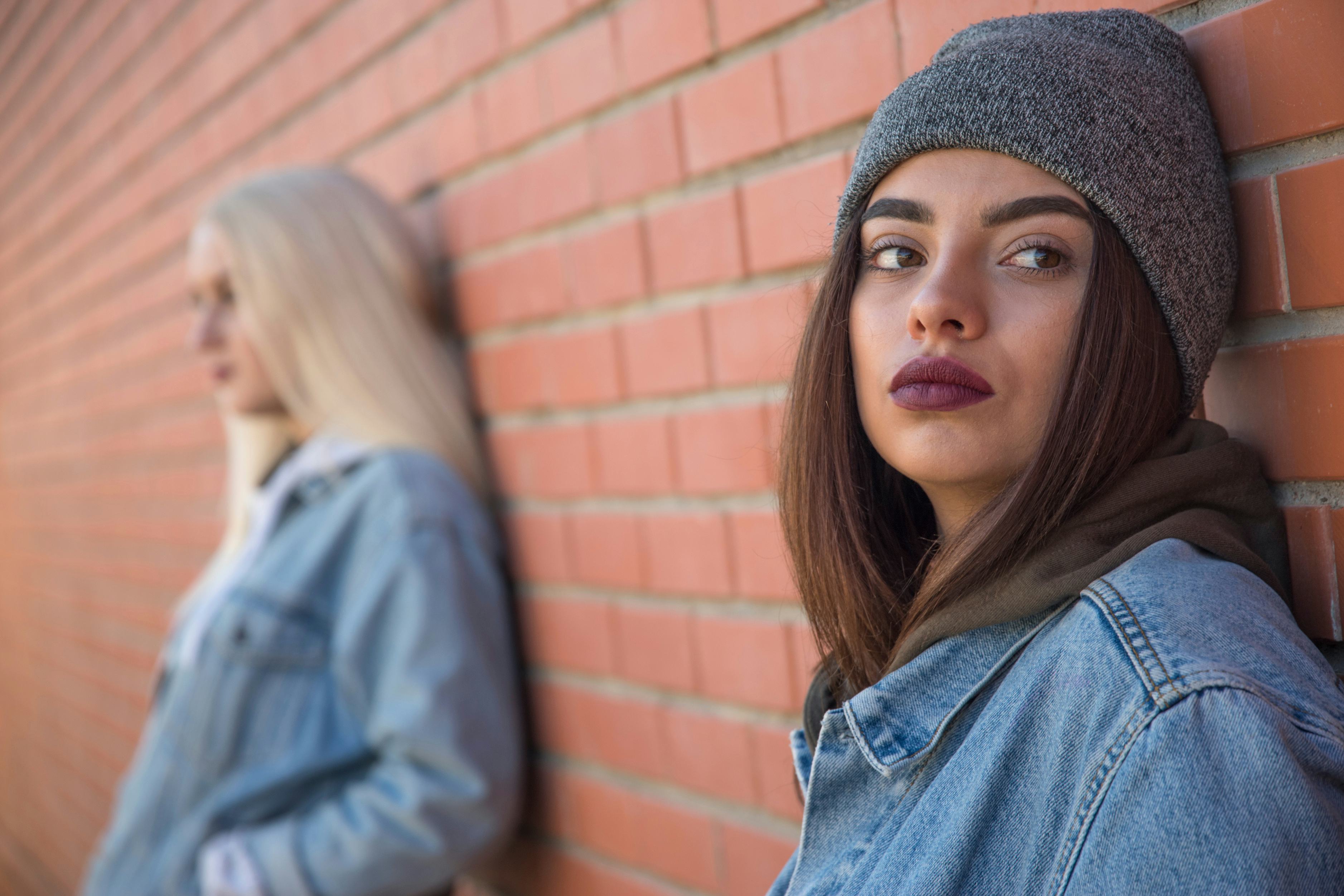 two friends are sad. One person against another