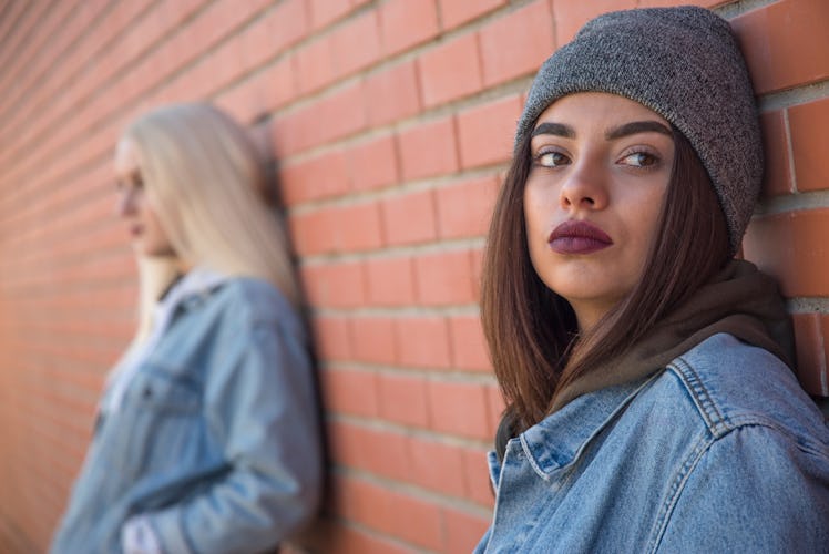 two friends are sad. One person against another