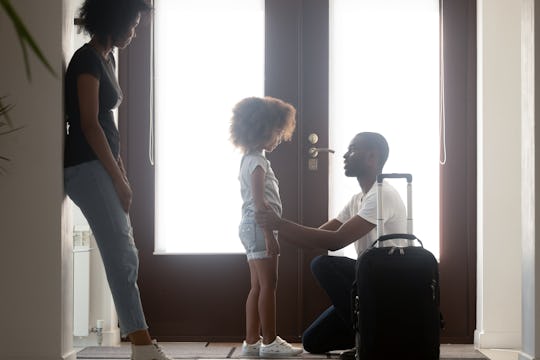 dad saying goodbye to daughter as mom watches