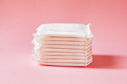women intimate hygiene products - sanitary pads on pink background