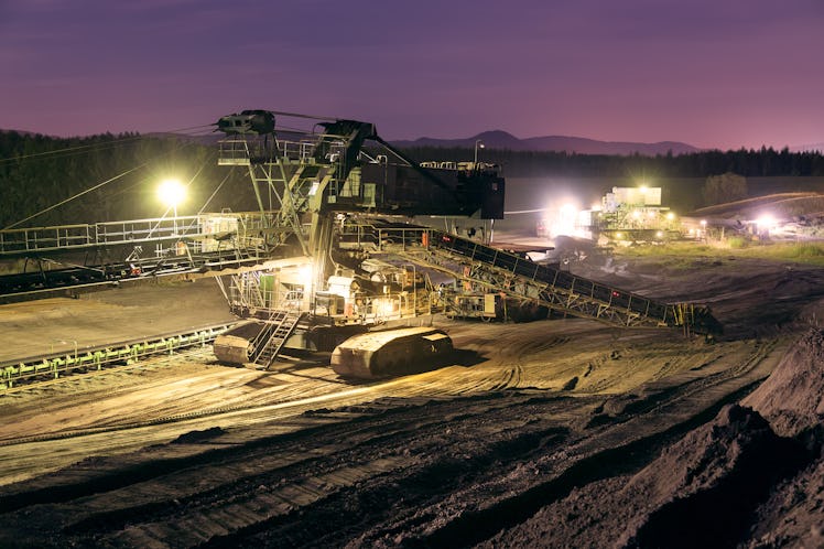 Heavy industrial machine in coal mine in the night