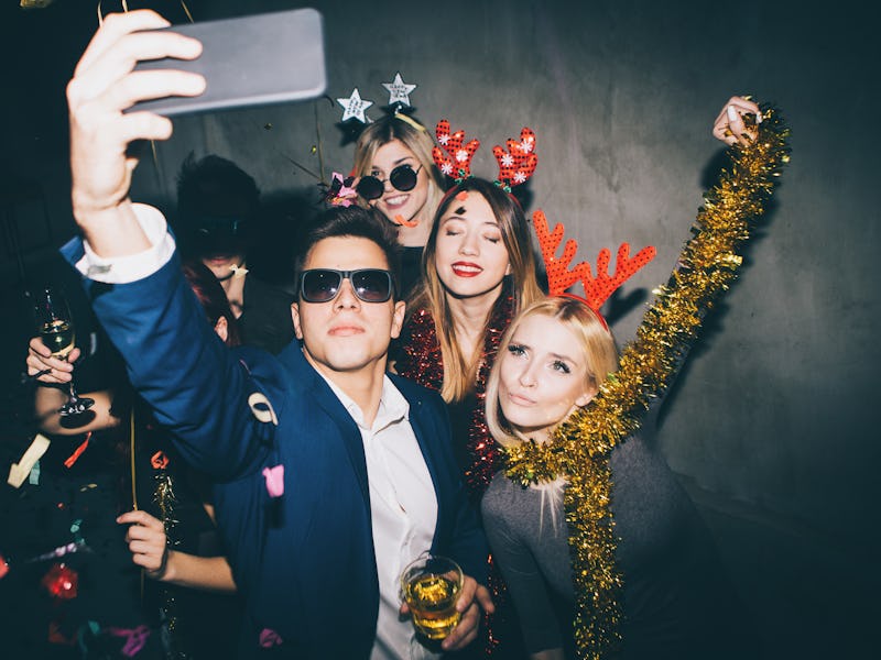 Group of friends at club making selfie and having fun