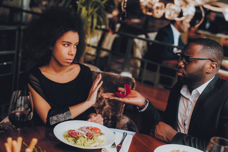 Man Proposing Engagement Ring and Getting Denied. Romantic African American Couple in Love Dating. C...