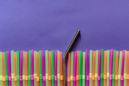 Plastic straws and reusable straw. Zero waste and plastic pollution concept