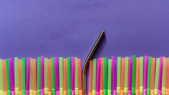 Plastic straws and reusable straw. Zero waste and plastic pollution concept