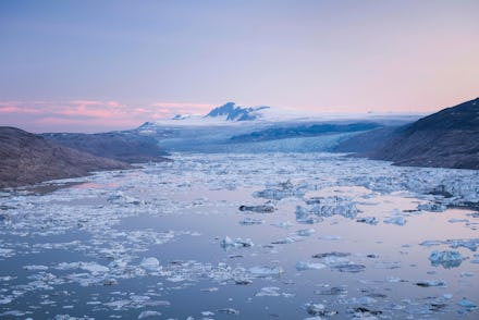 Lake with icebergs, glaciers and mountains at the back, dusk, West Greenland, Greenland