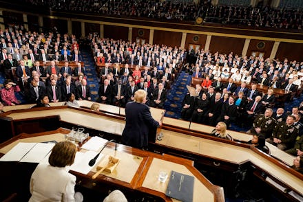US President Donald Trump (C) delivers his State of the Union address to a joint session of the US C...
