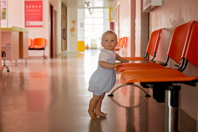 Cute baby boy, toddler child in waiting room in hospital, waiting for monthly check up