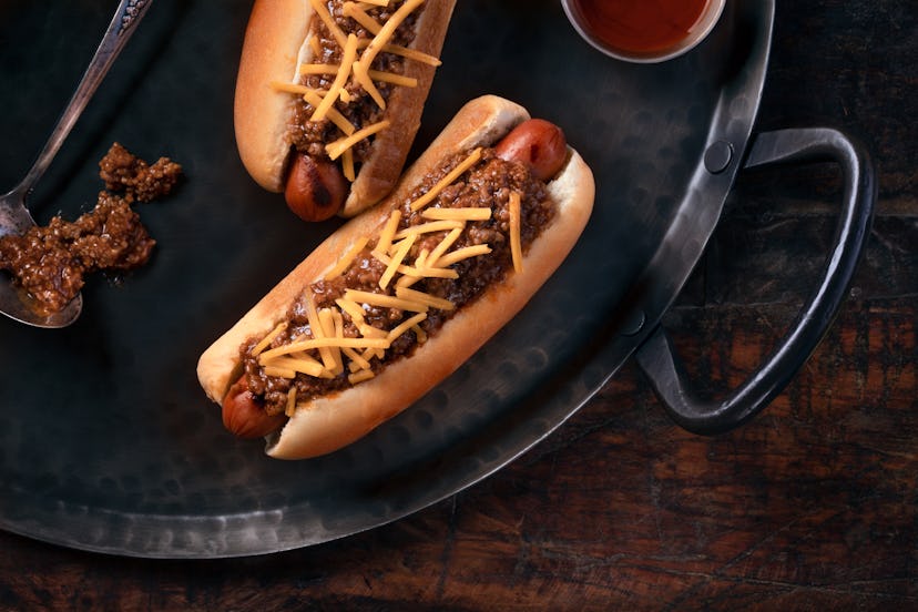 Chili cheese hot dogs on Metal platter