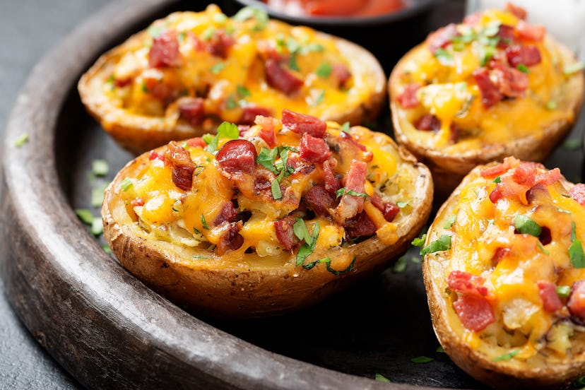 Hot baked potato topped with bacon, green onions and cheddar cheese.