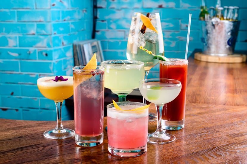 set of Classic alcoholic cocktails on bar counter in pup or restaurant