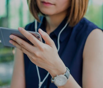 Woman is watching a video on her mobile