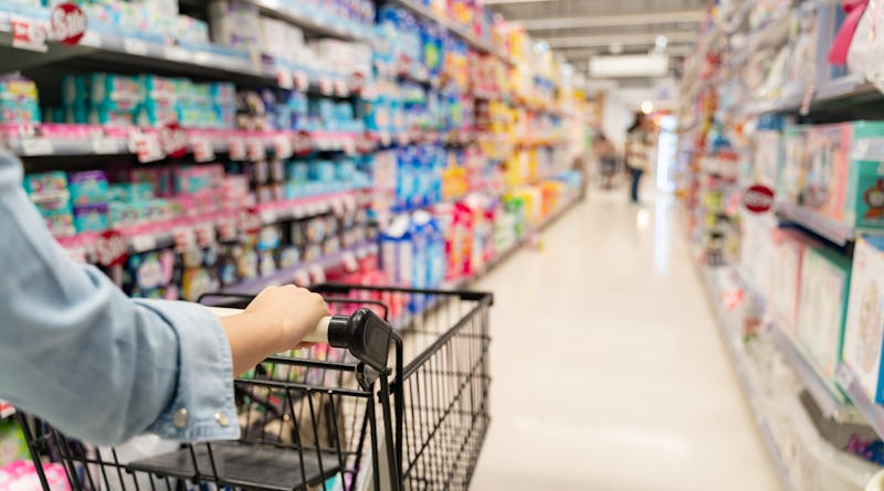 shopping in a supermarket concept.Shopping in supermarket a shopping cart view with motion blur.Clos...