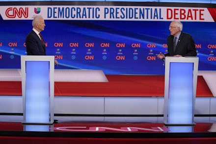 Sen. Bernie Sanders, I-Vt., and former Vice President Joe Biden, participate in a Democratic preside...