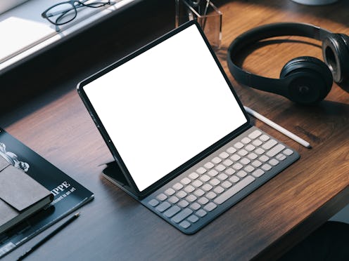 Home office with the tablet devise on table. Creative studio.
