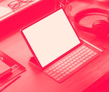 Home office with the tablet devise on table. Creative studio.