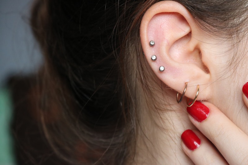 Thinking about going under the needle? Here's what to expect before a cartilage piercing, according ...