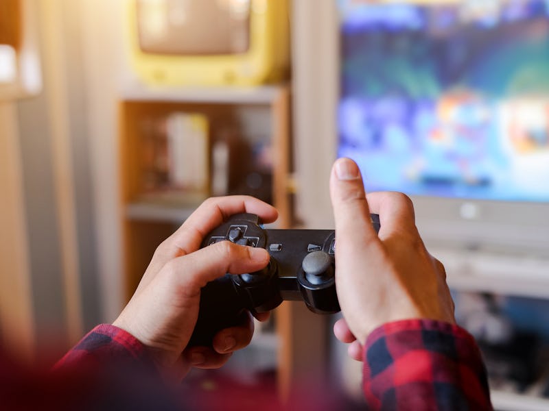 Man hand playing a computer games