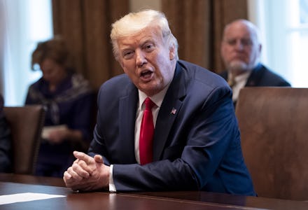 United States President Donald Trump speaks to reporters as he holds a meeting with nurses on the CO...