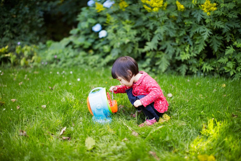 baby girl play bubble at Spring garden