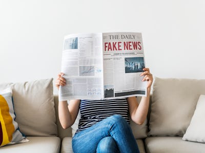 Woman reading newspaper