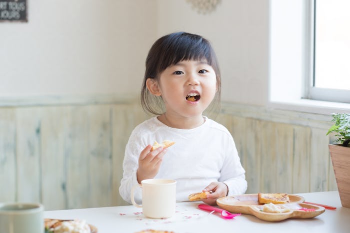 asian cute girl having breakfast