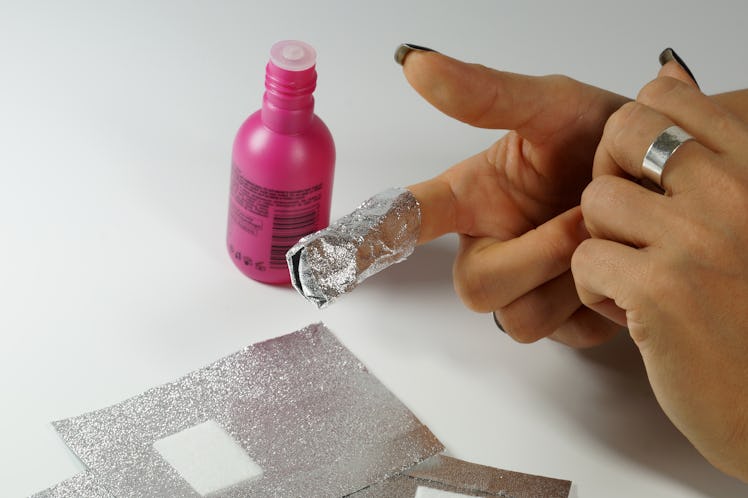 The procedure for removing varnish from nails (hybrid varnish) in progress
Gel nail polish remover a...