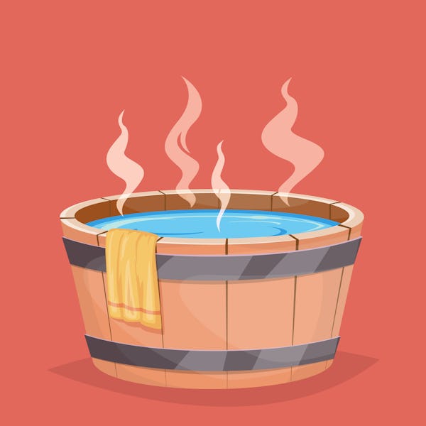 Wooden hot tub and towel