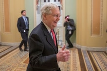 Republican Senate Majority Leader Mitch McConnell gives a thumbs up while arriving at the Senate cha...
