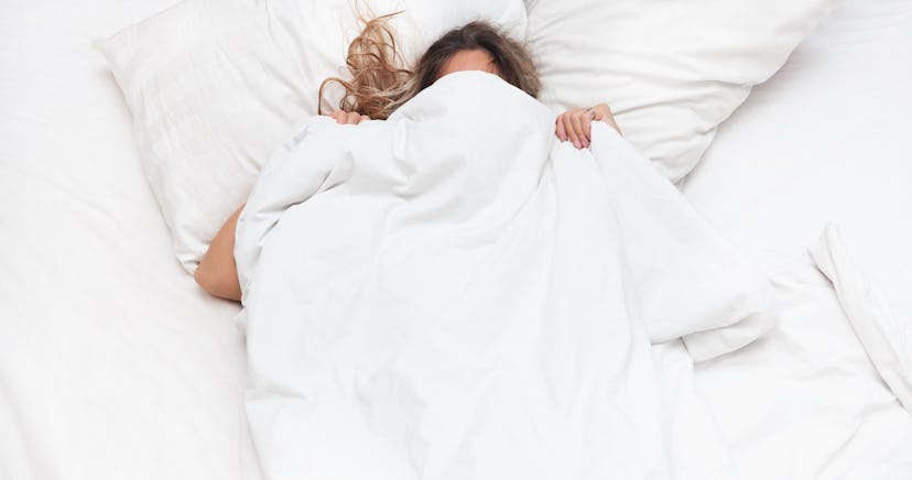 Woman in the bed don't want to wake up in the morning