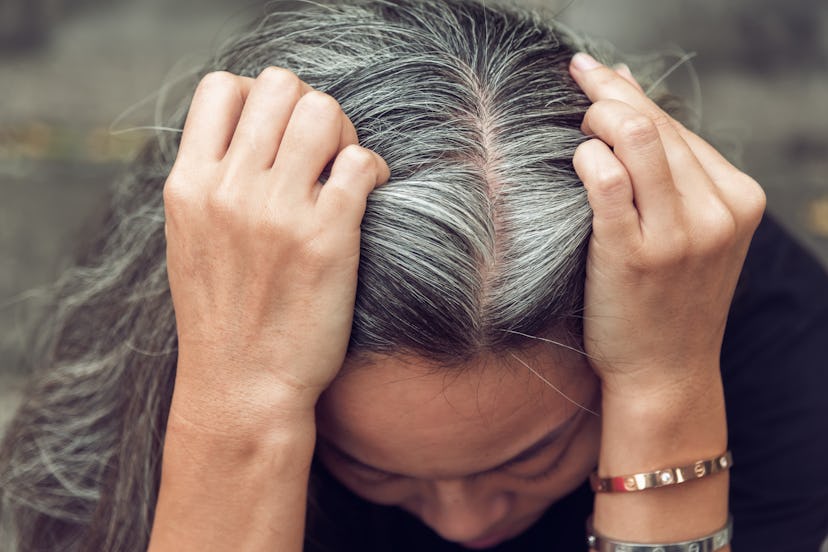 Closeup sad asian young beautiful woman and gray hair with worried stressed face expression looking ...