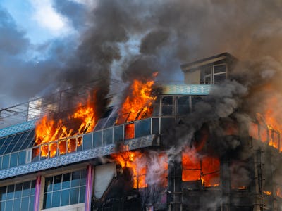 Burning building in thick smoke