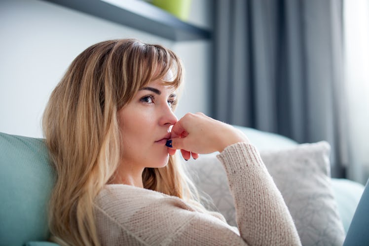 Woman at home deep in thoughts thinking and planning