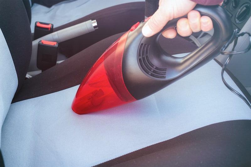 Car cleaning with handheld vacuum cleaner