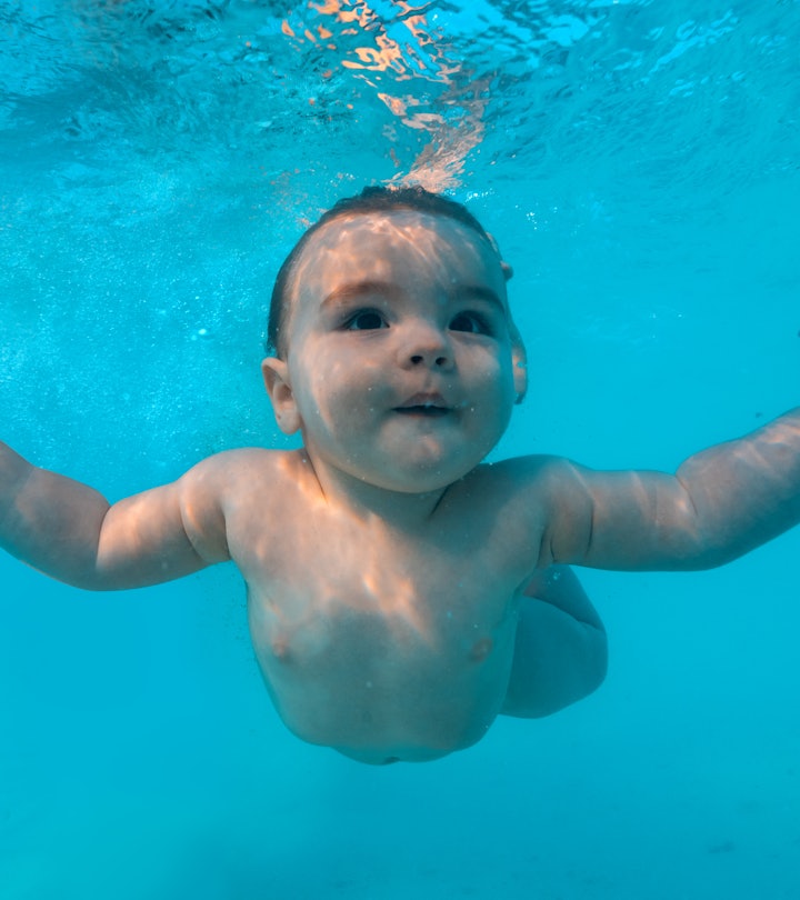Beautiful Baby infant in sea, Pisces baby