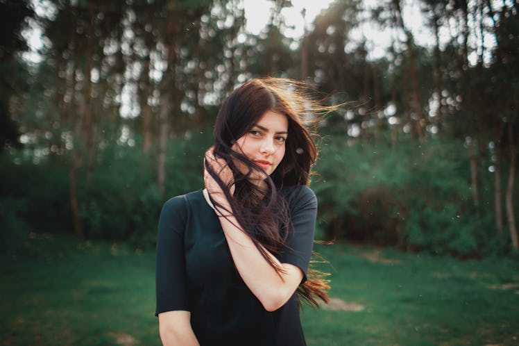 Beautiful young girl is in the nature