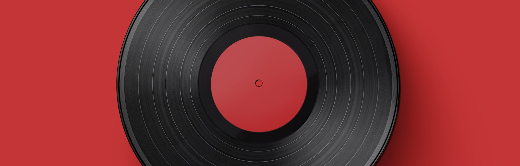 Vinyl record on a colored background. Old vintage vinyl record isolated