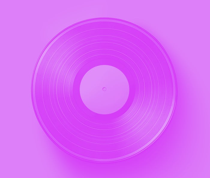 Vinyl record on a colored background. Old vintage vinyl record isolated