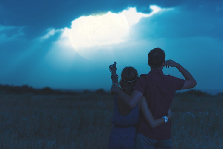 Couple enjoying under the moonlight in nature. My astronomy work.