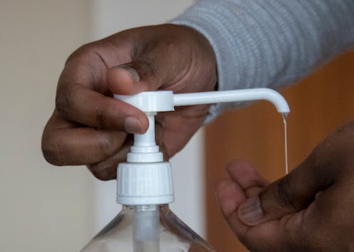 Man using disinfectant hand sanitiser to prevent corona virus