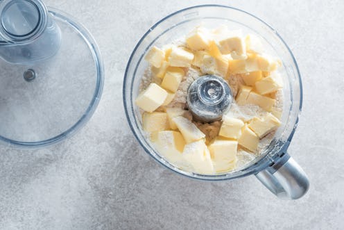 Dough prepaing in a food processor. Batter making fast and easy.