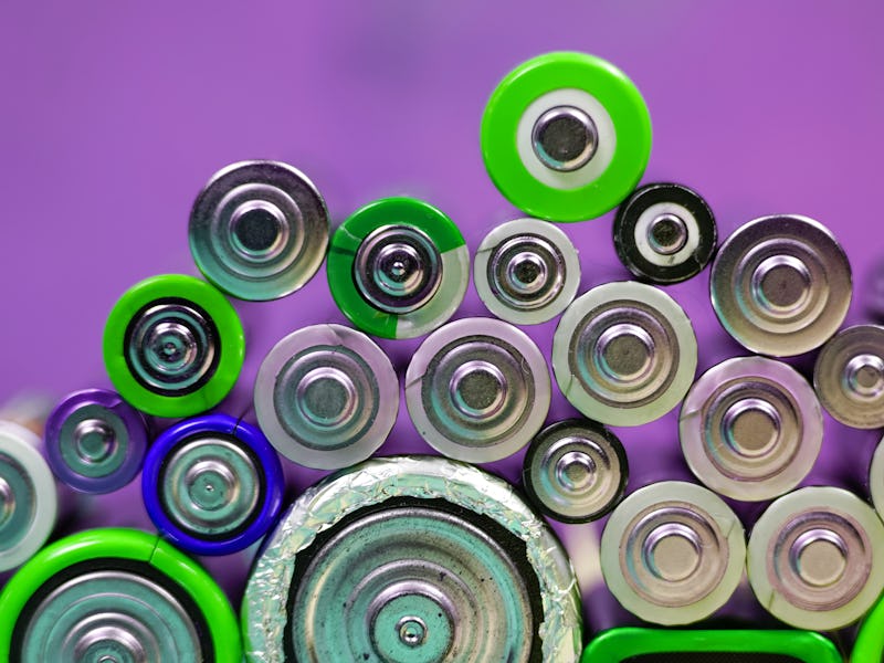 Ecology recycling concept. Many different types used or new battery, rechargeable accumulator, alkal...