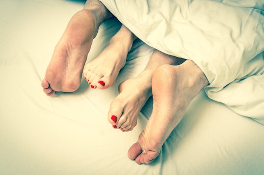 close up of couples' feet during intimacy