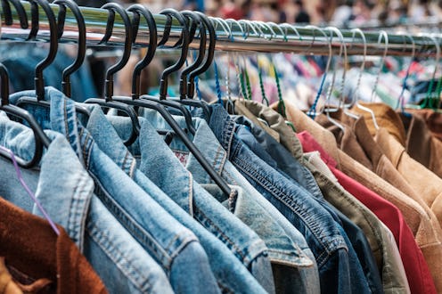 Jeans jackets and retro shirts on second hand market / flea market - vintage clothing -