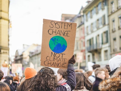 Group of demonstrators fight for climate change - Global warming and enviroment concept - Focus on b...