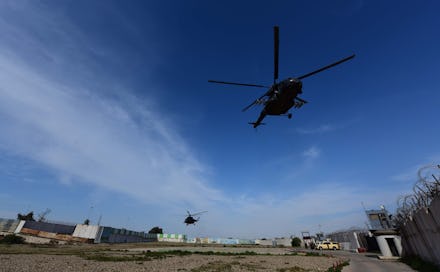 Iraqi military helicopters fly over the Al-Taqaddum Airbase (Habbaniyah), western Baghdad, Iraq on 0...