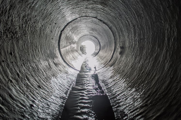 Exit from the drainage sewage tunnel pipe. Concrete Drainage Pipe, collector of city sewage system